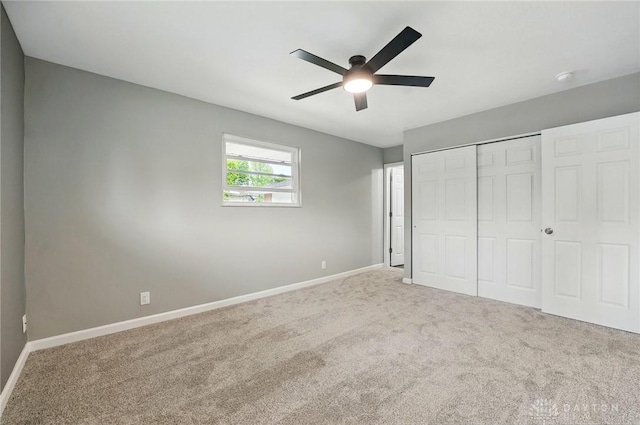 3040 Fontano Dr, Kettering, OH 45440 - unfurnished bedroom featuring carpet flooring, baseboards, a closet, and a ceiling fan