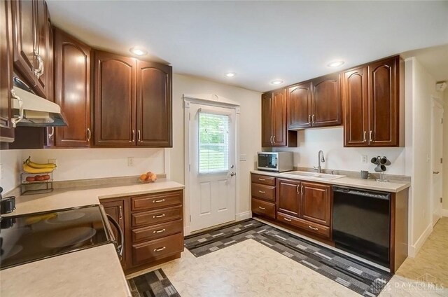 5829 Watt Rd, Camden, OH 45311 - kitchen with dishwasher, a sink, under cabinet range hood, light countertops, and recessed lighting