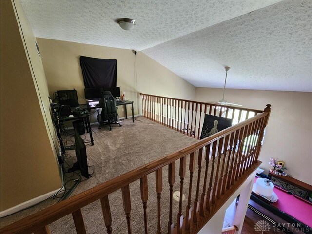 2380 Patterson Ln, Troy, OH 45373 - staircase featuring lofted ceiling, carpet floors, ceiling fan, and a textured ceiling
