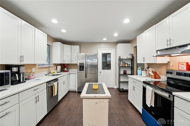 2942 Stauffer Dr, Beavercreek, OH 45434 - kitchen featuring appliances with stainless steel finishes, under cabinet range hood, a sink, recessed lighting, and light countertops