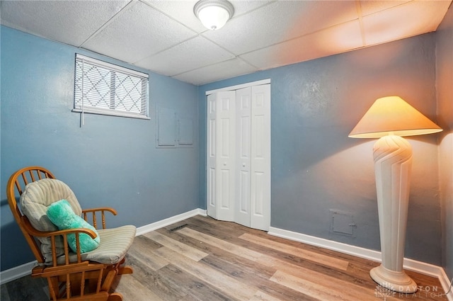 2942 Stauffer Dr, Beavercreek, OH 45434 - sitting room with wood finished floors, a paneled ceiling, and baseboards
