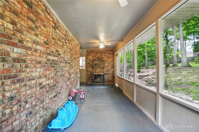 2942 Stauffer Dr, Beavercreek, OH 45434 - unfurnished sunroom with ceiling fan and an outdoor brick fireplace
