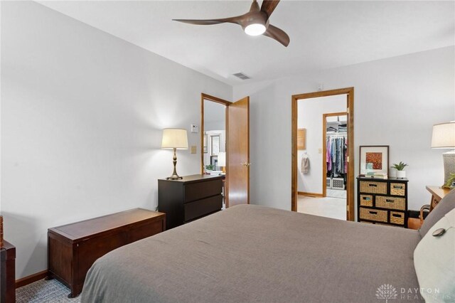 1462 Dee Anne Dr, Xenia, OH 45385 - bedroom featuring a spacious closet, baseboards, and a ceiling fan