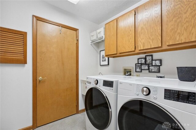 1462 Dee Anne Dr, Xenia, OH 45385 - washroom featuring independent washer and dryer, baseboards, and cabinet space