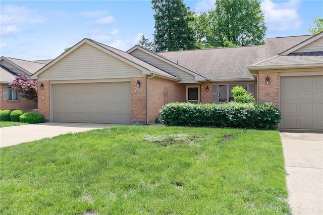 1462 Dee Anne Dr, Xenia, OH 45385 - ranch-style house featuring brick siding, a garage, driveway, a front lawn, and a shingled roof