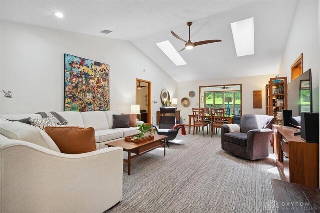 1462 Dee Anne Dr, Xenia, OH 45385 - living room featuring a skylight, a ceiling fan, carpet floors, and high vaulted ceiling