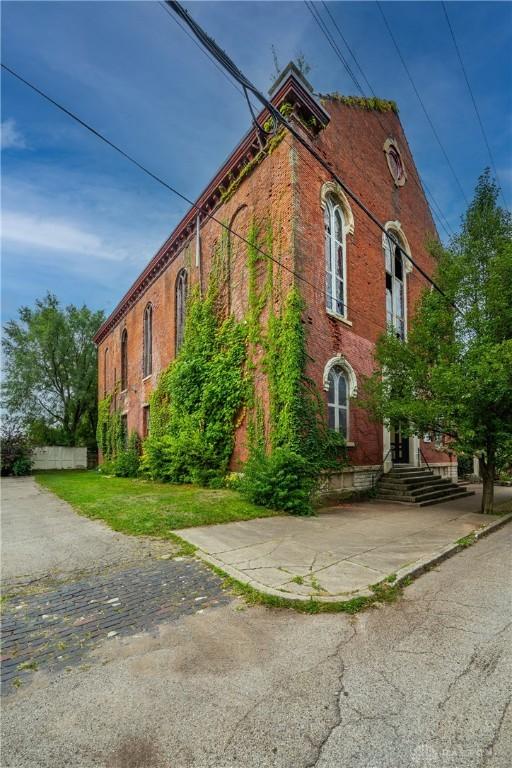 1420 E 4th St, Dayton, OH 45402 - view of property exterior featuring brick siding