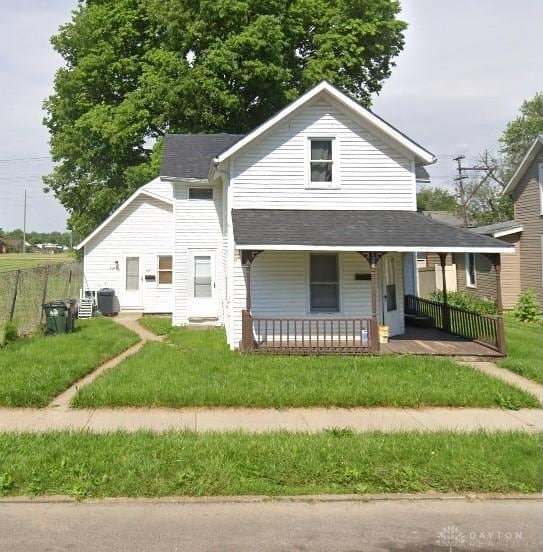 624 S Clay St, Troy, OH 45373 - view of front of home with covered porch, a front yard, and a shingled roof