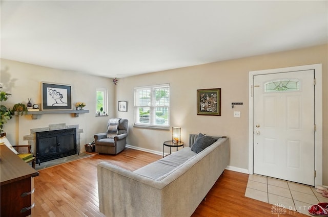 448 Triangle Ave, Oakwood, OH 45419 - living room featuring a fireplace with flush hearth and light wood finished floors
