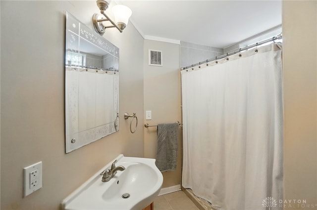 448 Triangle Ave, Oakwood, OH 45419 - full bath with tile patterned floors, curtained shower, and crown molding