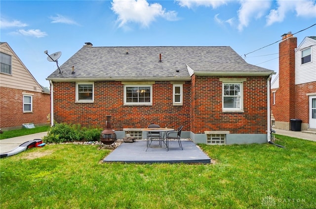 448 Triangle Ave, Oakwood, OH 45419 - back of property featuring a yard, brick siding, a patio area, and a shingled roof