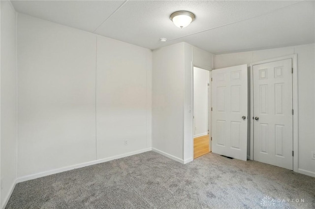665 Diamond Loop, Middletown, OH 45044 - unfurnished bedroom featuring carpet and baseboards