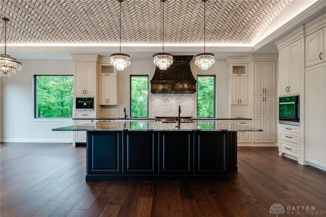 6481 Stagecoach Way, Liberty Twp, OH 45011 - kitchen featuring a chandelier, backsplash, plenty of natural light, dark stone counters, and ornamental molding