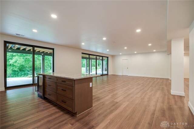 6481 Stagecoach Way, Liberty Twp, OH 45011 - unfurnished room featuring light wood-type flooring, recessed lighting, baseboards, and wine cooler