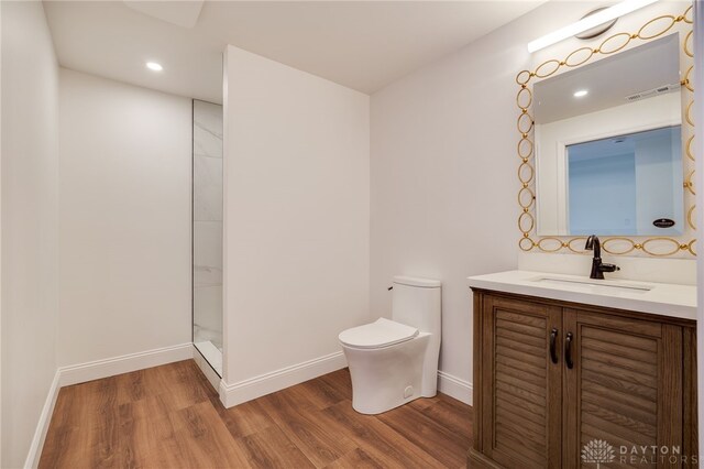 6481 Stagecoach Way, Liberty Twp, OH 45011 - bathroom with wood finished floors, vanity, toilet, a shower, and recessed lighting