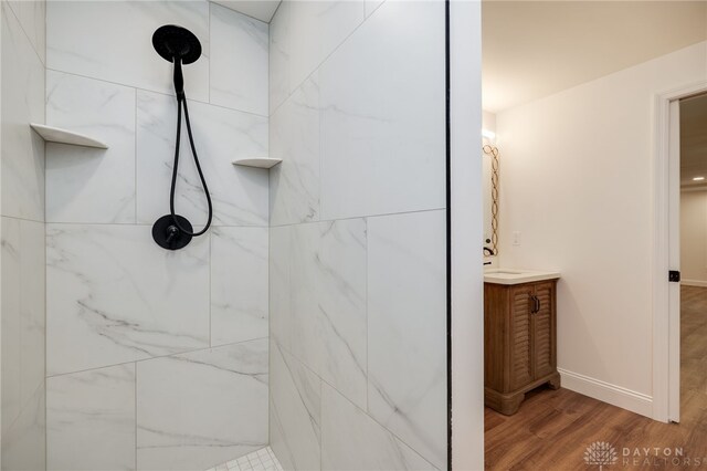 6481 Stagecoach Way, Liberty Twp, OH 45011 - full bathroom featuring wood finished floors, tiled shower, vanity, and baseboards