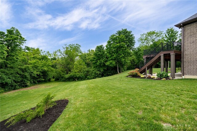 6481 Stagecoach Way, Liberty Twp, OH 45011 - view of green lawn featuring stairs and a deck