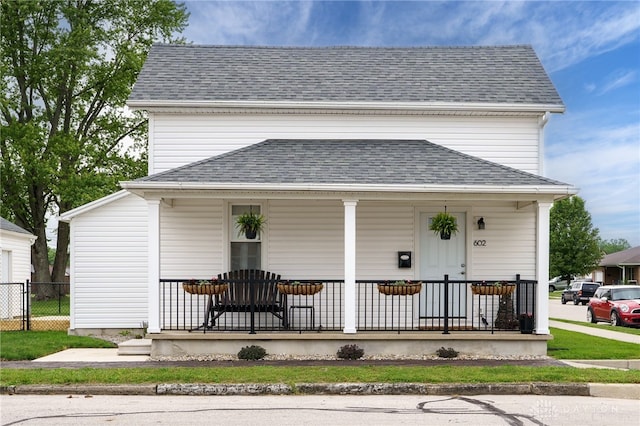 602 W N St, Arcanum, OH 45304 - view of front facade with covered porch and a shingled roof