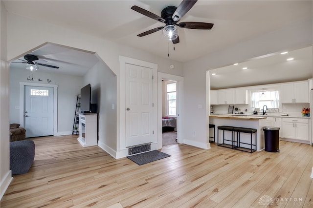 602 W N St, Arcanum, OH 45304 - living area featuring ceiling fan and light wood finished floors