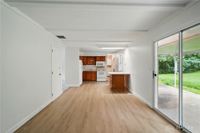 2424 Pinegrove Dr, Dayton, OH 45449 - kitchen featuring white appliances, light wood-type flooring, brown cabinets, baseboards, and light countertops