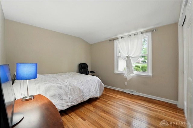 5571 Hugh Dr, Dayton, OH 45459 - bedroom with wood-type flooring, baseboards, and vaulted ceiling