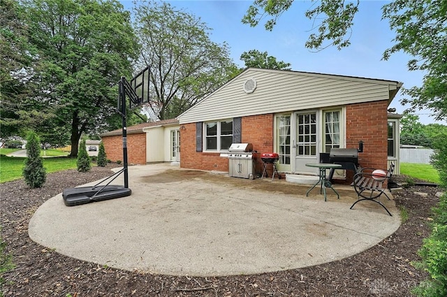 5571 Hugh Dr, Dayton, OH 45459 - rear view of house with a patio area and brick siding