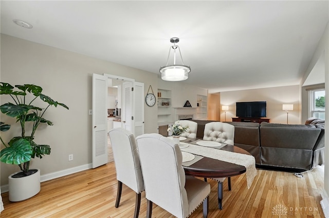 5571 Hugh Dr, Dayton, OH 45459 - dining space with light wood-style floors and baseboards