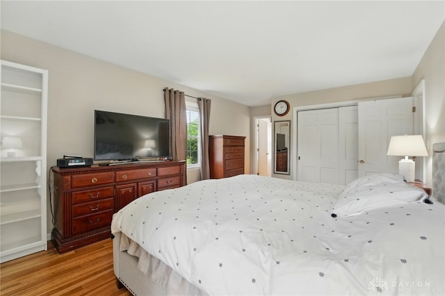 5571 Hugh Dr, Dayton, OH 45459 - bedroom featuring a closet and light wood-style flooring