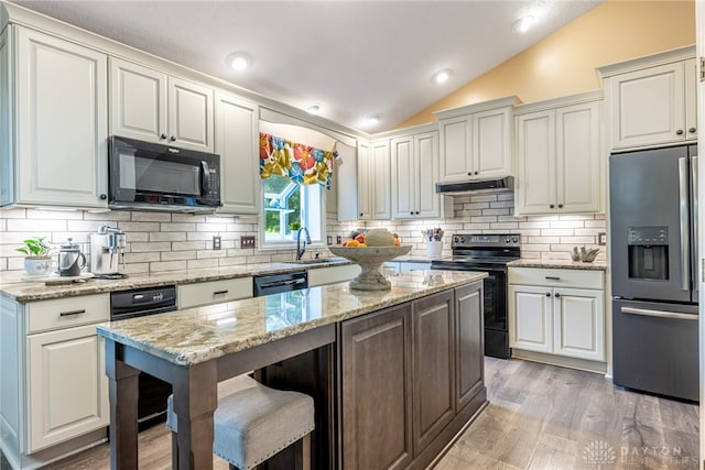 2182 Sharon View Ct, Lebanon, OH 45036 - kitchen featuring black appliances, vaulted ceiling, backsplash, light wood-type flooring, and a sink