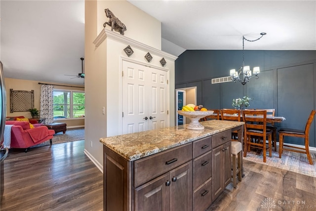 2182 Sharon View Ct, Lebanon, OH 45036 - kitchen with lofted ceiling, dark wood-style flooring, a chandelier, light stone countertops, and a ceiling fan