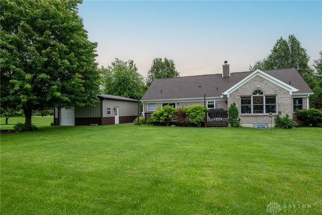 2182 Sharon View Ct, Lebanon, OH 45036 - back of house with a chimney, a lawn, a garage, and an outdoor structure