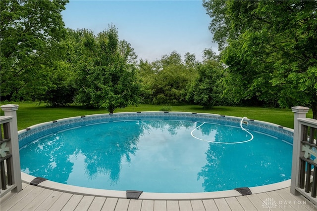 2182 Sharon View Ct, Lebanon, OH 45036 - swimming pool with a deck, a lawn, and view of scattered trees