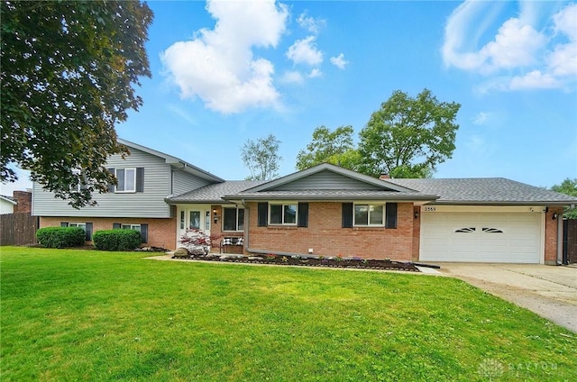 2369 Brown Bark Dr, Beavercreek, OH 45431 - tri-level home with an attached garage, concrete driveway, and brick siding