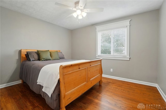 2369 Brown Bark Dr, Beavercreek, OH 45431 - bedroom featuring baseboards, wood finished floors, and ceiling fan