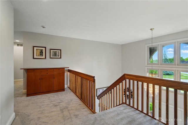 10550 Willow Brook Rd, Dayton, OH 45458 - hall with light carpet, an upstairs landing, and baseboards