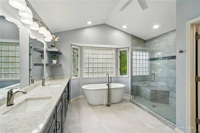 10550 Willow Brook Rd, Dayton, OH 45458 - full bath with a soaking tub, double vanity, vaulted ceiling, a stall shower, and ceiling fan
