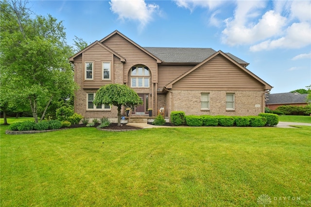 10550 Willow Brook Rd, Dayton, OH 45458 - traditional-style home featuring brick siding and a front yard
