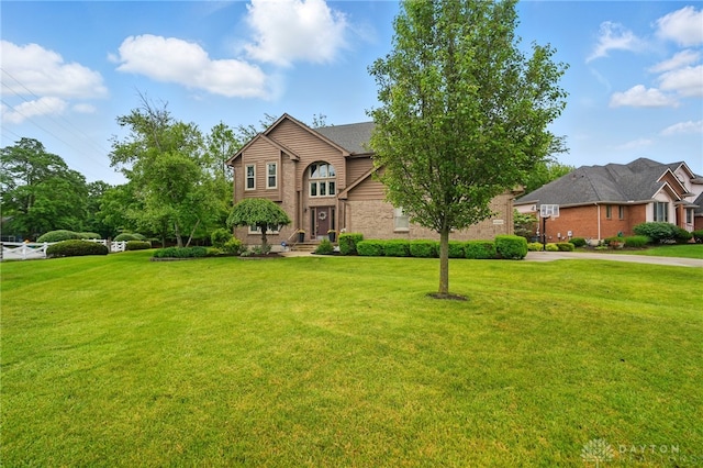 10550 Willow Brook Rd, Dayton, OH 45458 - traditional-style home featuring brick siding and a front yard