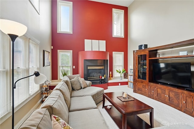 10550 Willow Brook Rd, Dayton, OH 45458 - living room featuring a tiled fireplace and a towering ceiling