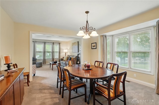 10550 Willow Brook Rd, Dayton, OH 45458 - dining room with plenty of natural light, light carpet, and baseboards