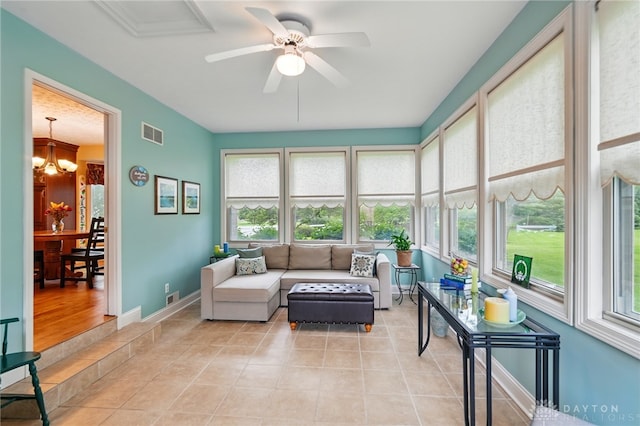 10550 Willow Brook Rd, Dayton, OH 45458 - living area featuring a chandelier, ceiling fan, light tile patterned flooring, and baseboards
