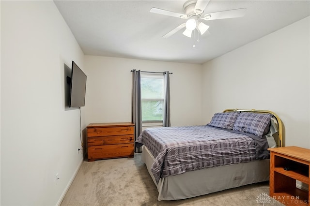 10550 Willow Brook Rd, Dayton, OH 45458 - bedroom featuring light colored carpet, baseboards, and a ceiling fan