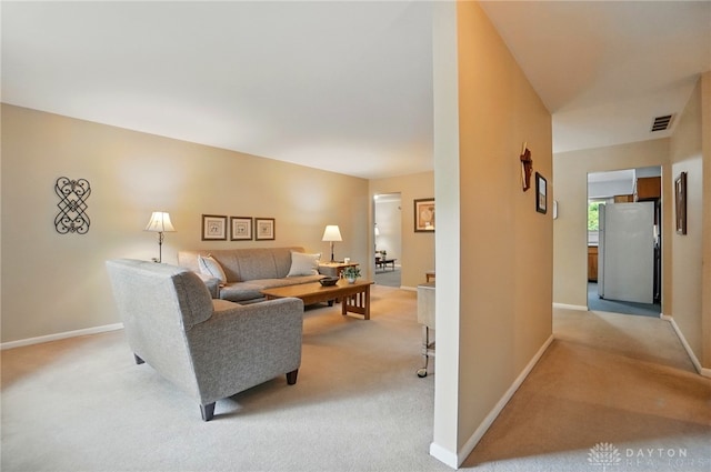 600 Deauville Dr, Washington Twp, OH 45429 - living room with light colored carpet and baseboards
