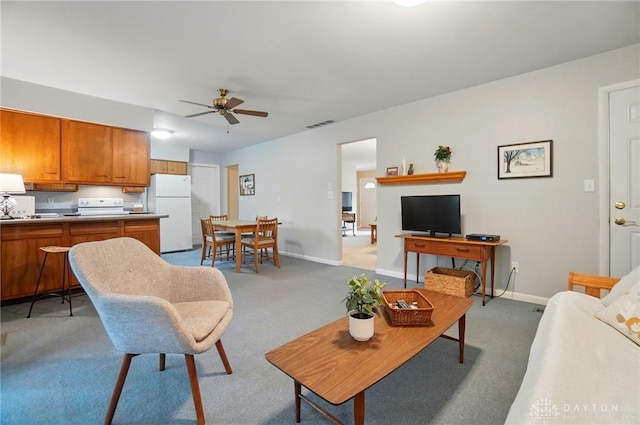 600 Deauville Dr, Washington Twp, OH 45429 - living area with a ceiling fan, light colored carpet, and baseboards