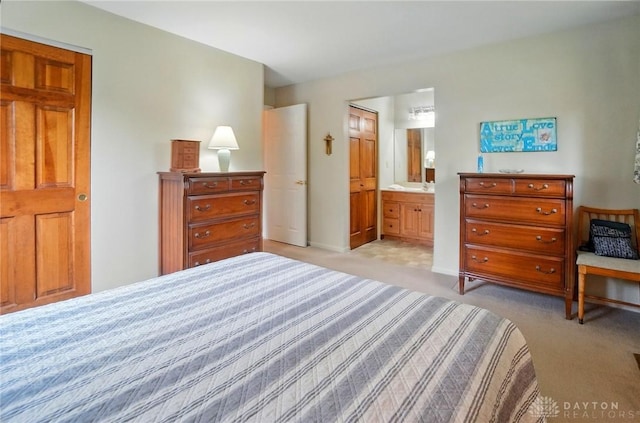 600 Deauville Dr, Washington Twp, OH 45429 - bedroom featuring light carpet and connected bathroom