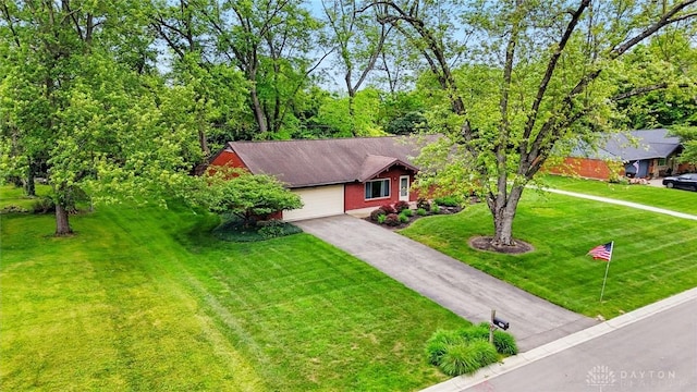 600 Deauville Dr, Washington Twp, OH 45429 - view of front facade featuring asphalt driveway, an attached garage, and a front lawn