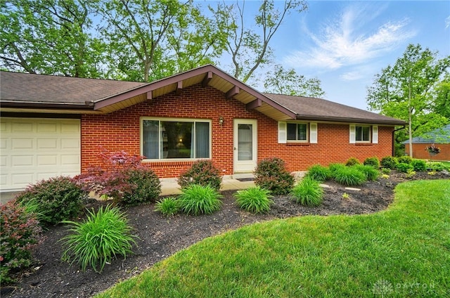 600 Deauville Dr, Washington Twp, OH 45429 - ranch-style house with an attached garage, brick siding, a front yard, and a shingled roof