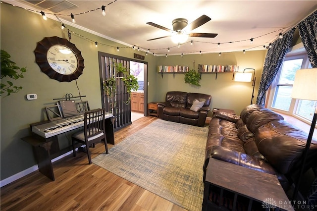 1265 Jeanette Dr, Dayton, OH 45432 - living area featuring track lighting, wood finished floors, healthy amount of natural light, and a ceiling fan