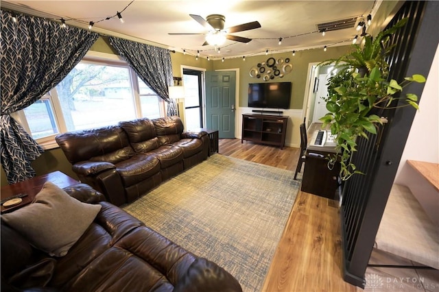 1265 Jeanette Dr, Dayton, OH 45432 - living area with rail lighting, a ceiling fan, and wood finished floors