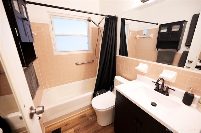 1265 Jeanette Dr, Dayton, OH 45432 - bathroom featuring shower / bath combination with curtain, toilet, tile walls, vanity, and wood finished floors